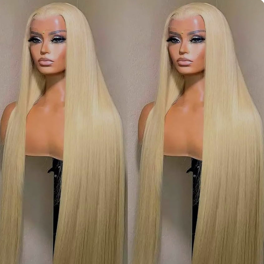 Two blonde wigs on mannequin heads against a neutral background